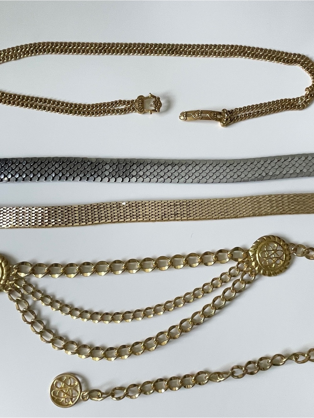 4 Metal Shiny Belts; Stretchy - one gold, one silver color, 2 chain belts gold
